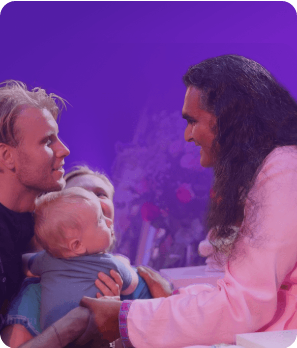 Paramahamsa Vishwananda with a family at darshan